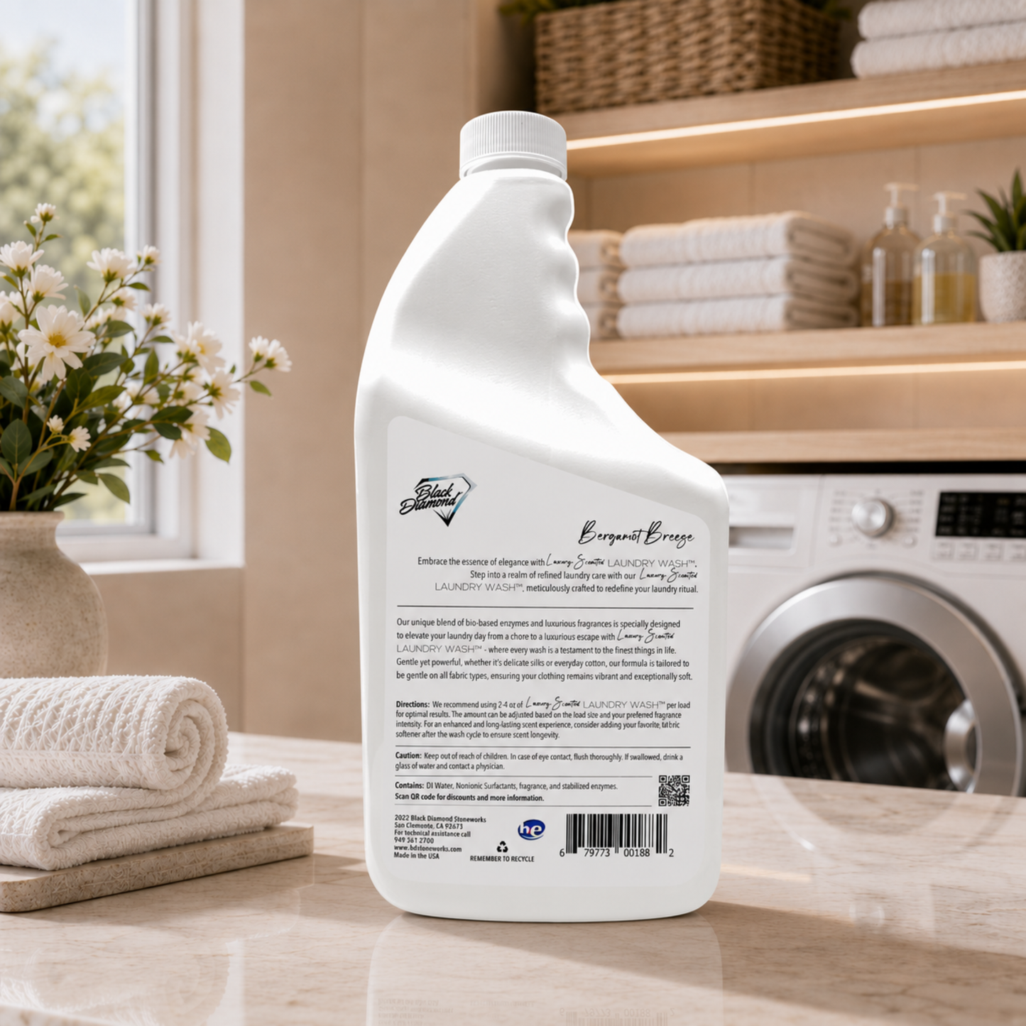 White bottle of laundry detergent on a kitchen counter with a washing machine and towels in the background.